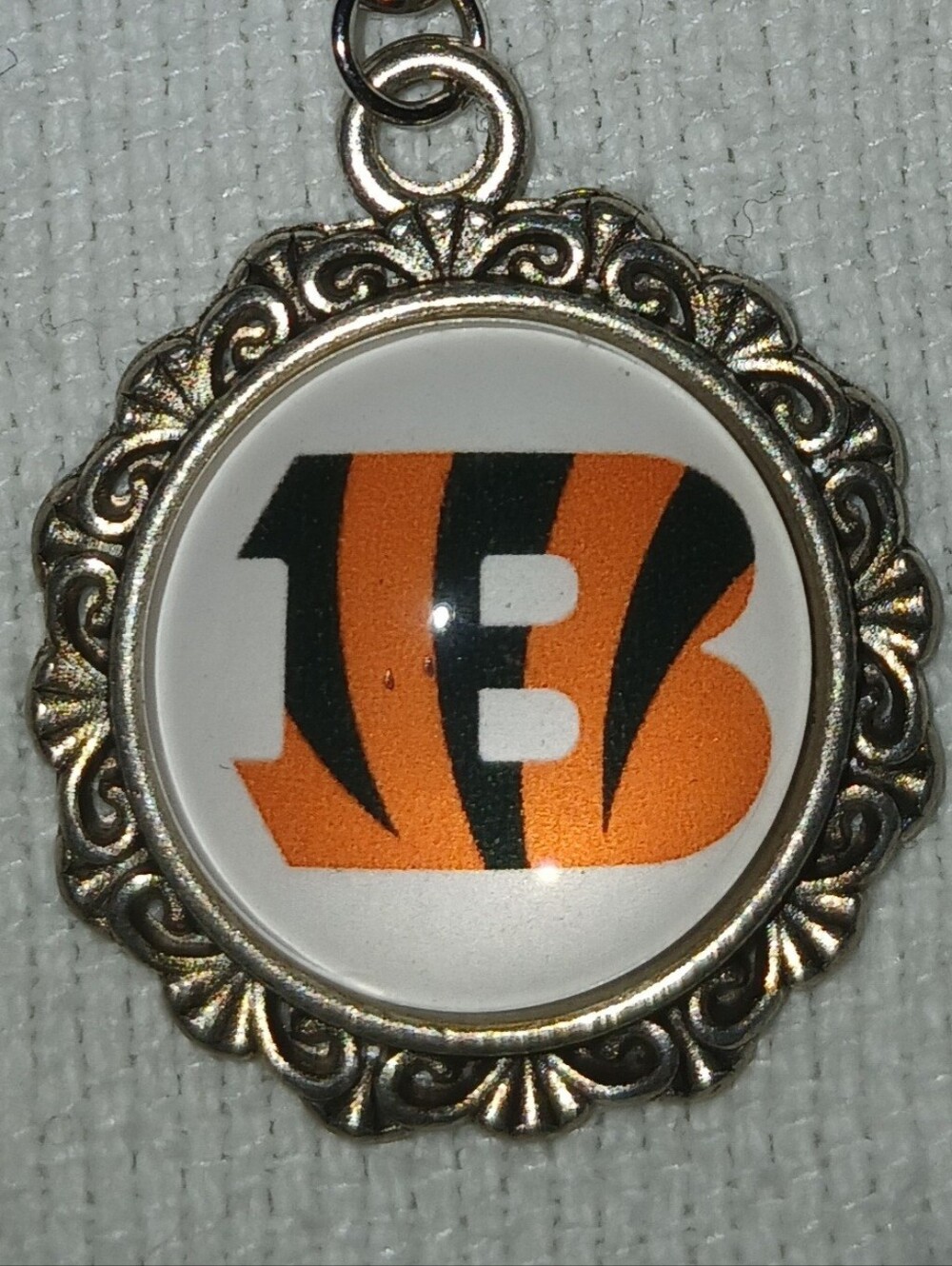 NWT Silver-Tone Orange and Black C.B. Team Keychain.
